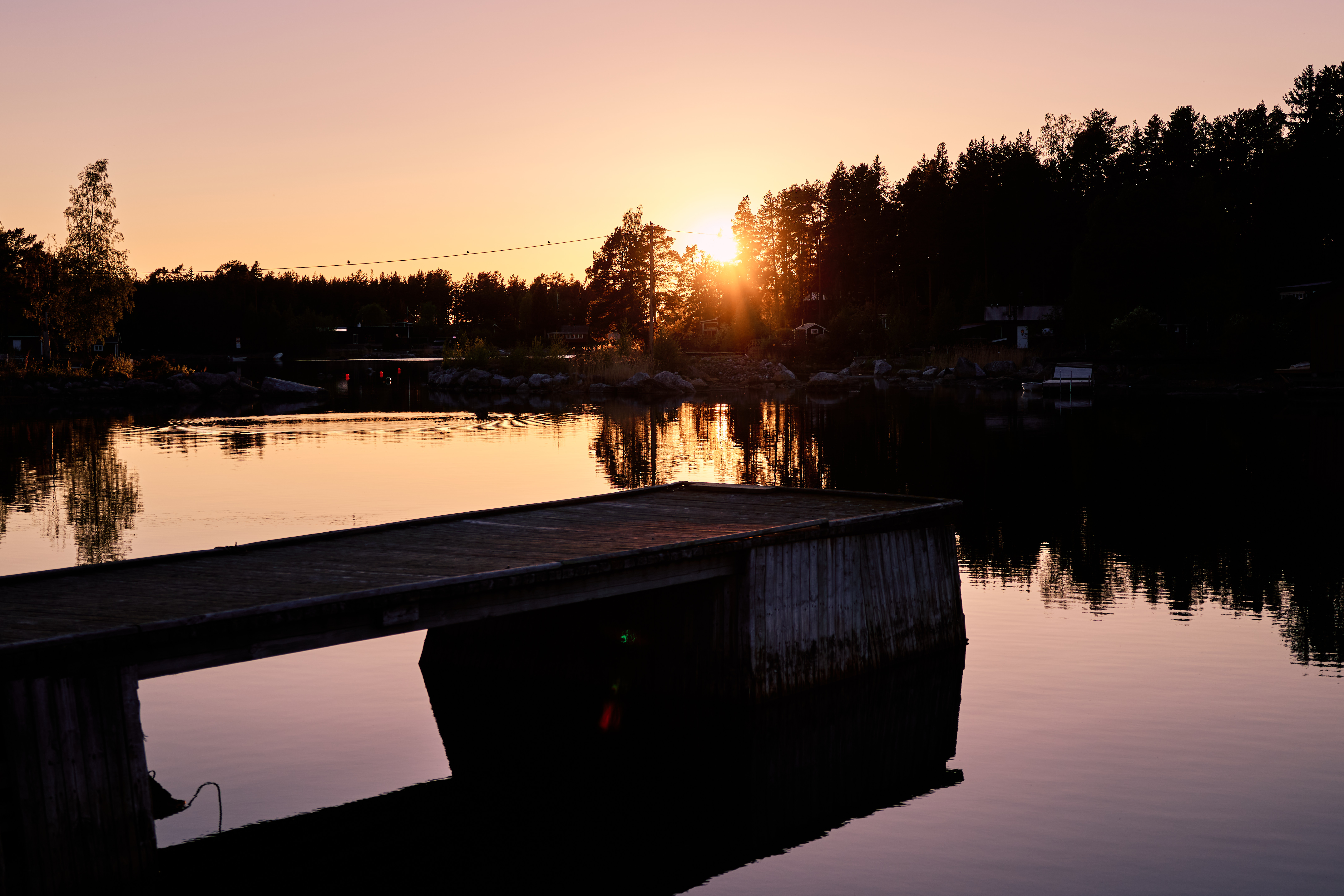 Wooden dock extending into the Baltic Sea at dawn, Söderhamn