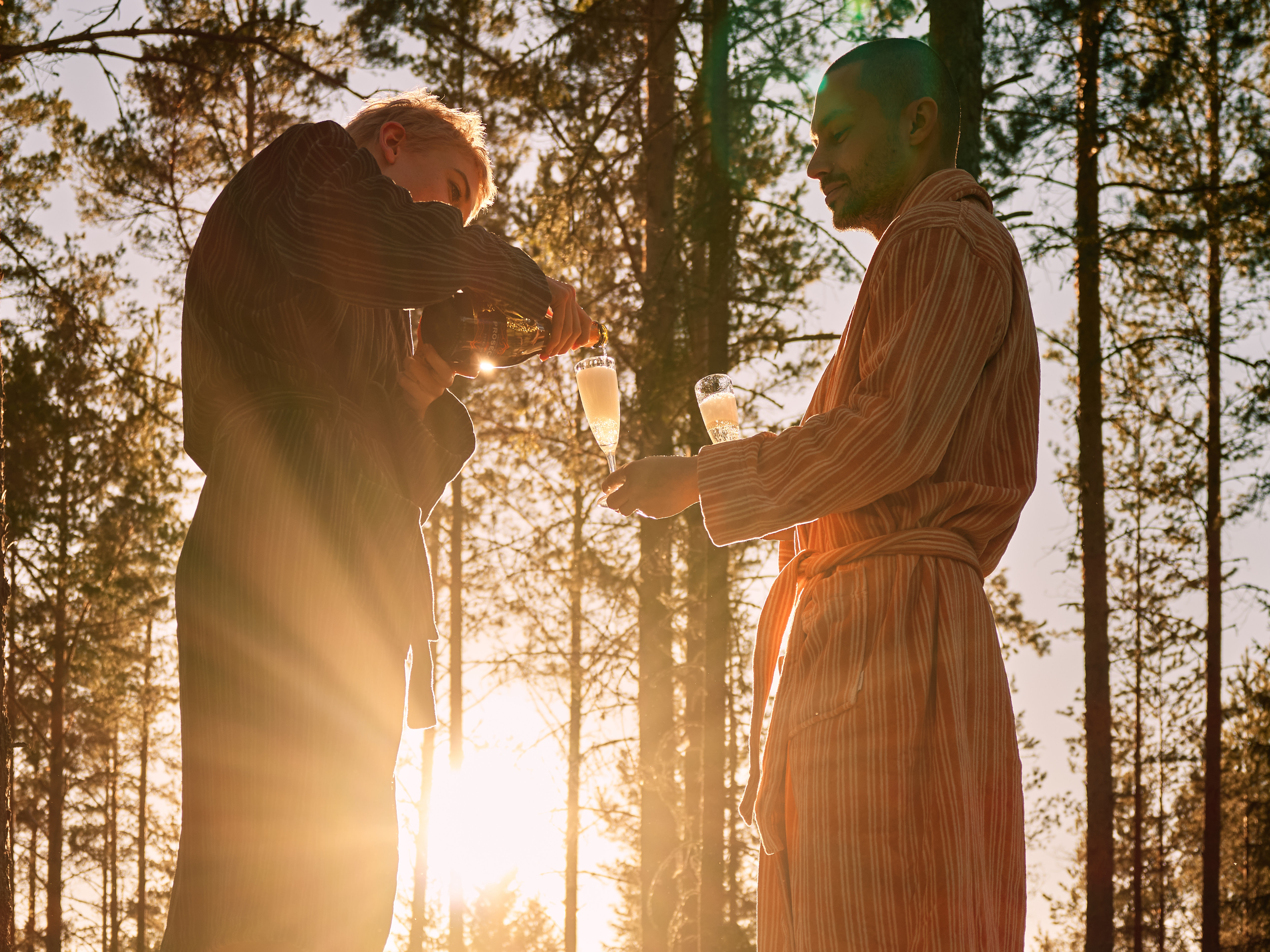 A figure walking through the Hälsingland forest near the Baltic, captured at golden hour