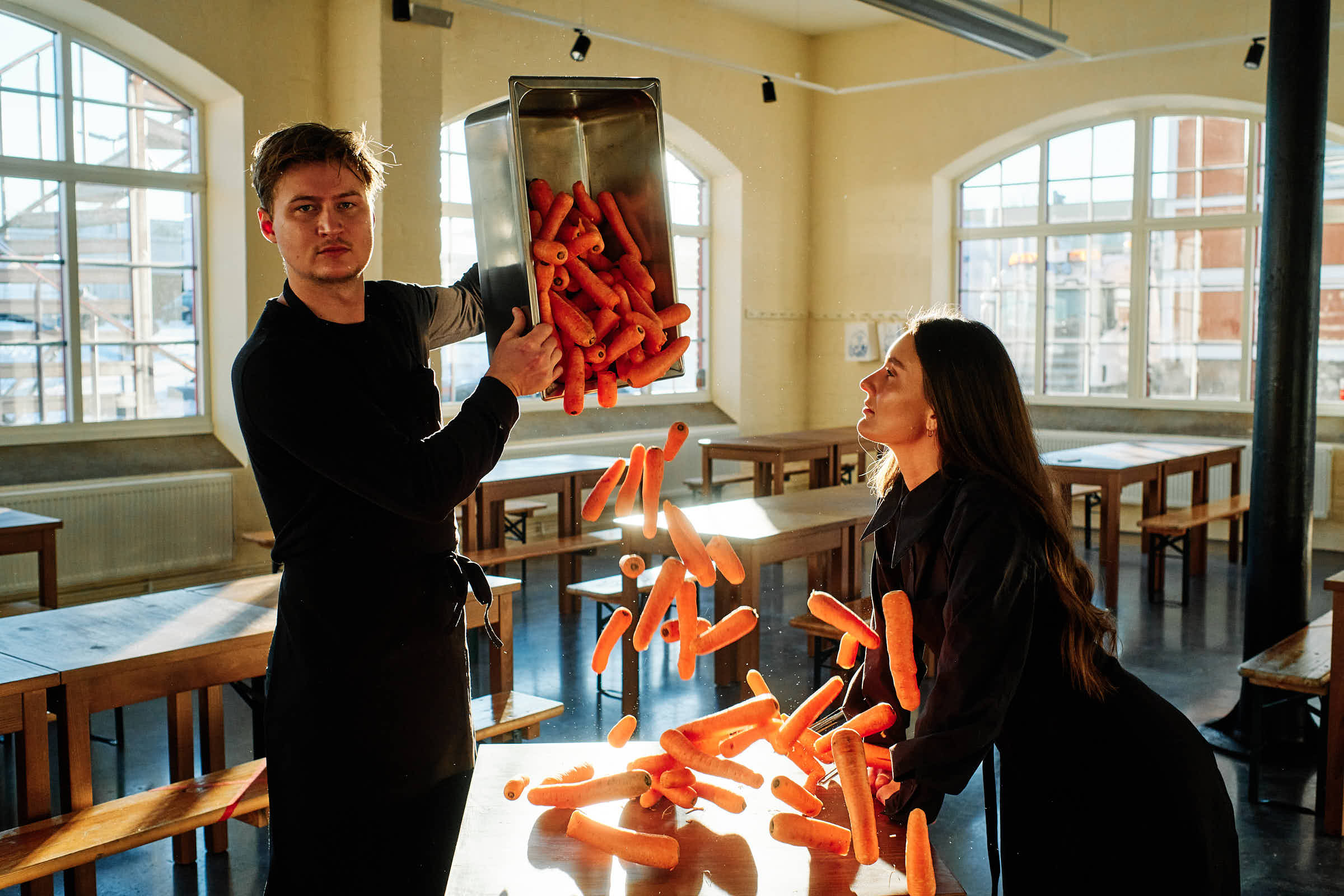 Fresh seasonal carrots being prepared at Salt Studio Gävle, natural light flooding the dining room