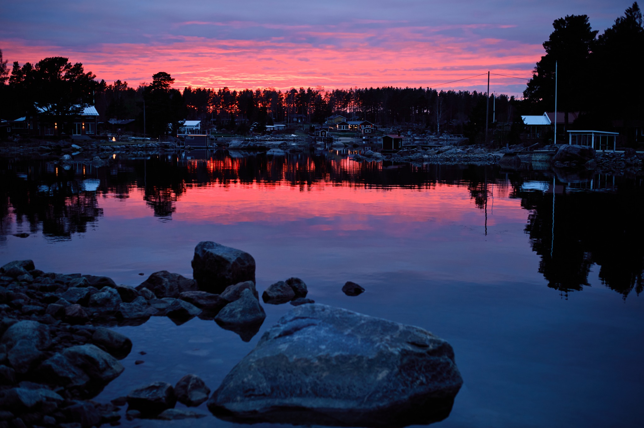 Pink sunset reflected on Baltic Sea water near Hop Farm Beach